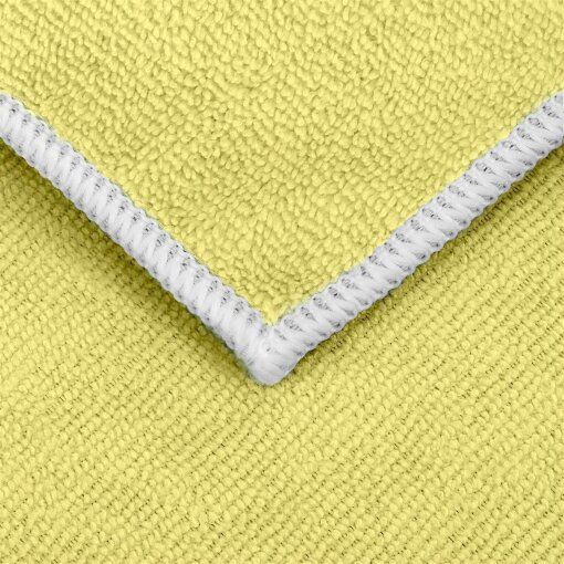 Detailaufnahme eines gelben Universal-Microfasertuchs mit weißem Saum.