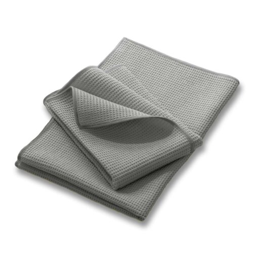 Gestapelte graue Microfaser Waffeltücher. Die Waffelstruktur des Reinigungstuchs ist deutlich zu erkennen